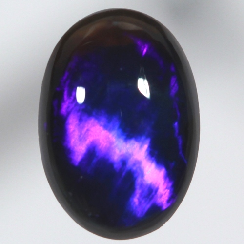 SOLID BLACK OPAL Bright electric blue. Broad rolling flash
